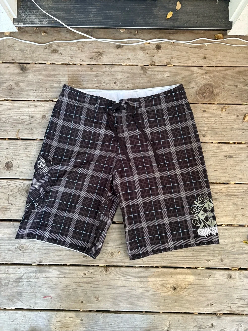 Quiksilver grail Black & Gray Plaid Board shorts.